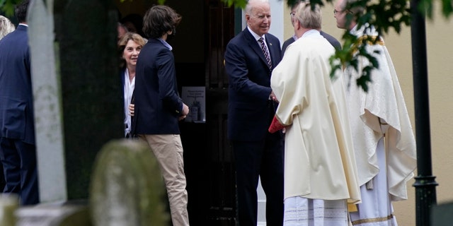 President Joe Biden speaks with priests as he departs after attending Mass at St. Joseph on the Brandywine Catholic Church, Sunday, May 30, 2021, in Wilmington, Del. (AP Photo/Patrick Semansky)