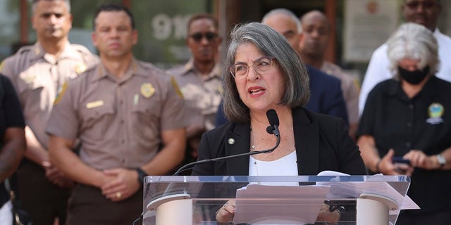Miami-Dade County Mayor Daniella Levine Cava, center, gives her opening remarks during a news conference about the Memorial Day weekend mass shootings, Monday, May 31, 2021 at the Fred Taylor Miami-Dade Police Headquarters in Doral, Fla. (Carl Juste/Miami Herald via AP)