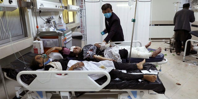 Afghan school students are treated at a hospital after a bomb explosion near a school in west of Kabul, Afghanistan, Saturday, May 8, 2021. A bomb exploded near a school in west Kabul on Saturday, killing several, many them young students, Afghan government spokesmen said. (AP Photo/Rahmat Gul)