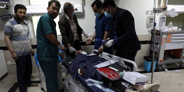 An Afghan school student is treated at a hospital after a bomb explosion near a school west of Kabul, Afghanistan, Saturday, May 8, 2021. A bomb exploded near a school in west Kabul on Saturday, killing several people, many them young students, an Afghan government spokesmen said. (AP Photo/Rahmat Gul)