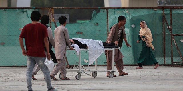 An injured school student is transported to a hospital after a bomb explosion near a school in west of Kabul, Afghanistan, Saturday, May 8, 2021. (Associated Press)