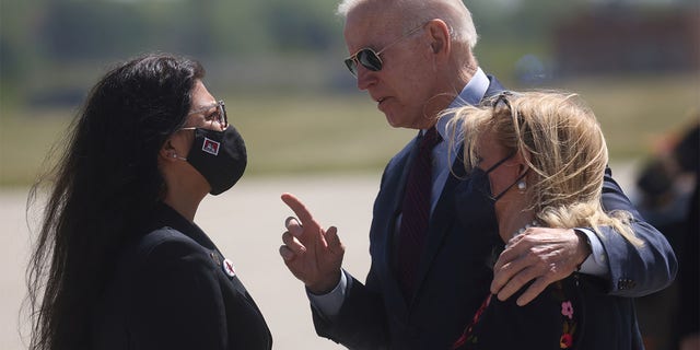 U.S. President Joe Biden is greeted by U.S. Rep. Debbie Dingell (D-MI) and U.S. Rep. Rashida Tlaib  at Detroit Metropolitan Wayne County Airport, Detroit, Michigan,U.S., May 18, 2021. REUTERS/Leah Millis