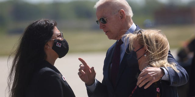 U.S. President Joe Biden is greeted by U.S. Rep. Debbie Dingell (D-MI) and U.S. Rep. Rashida Tlaib at Detroit Metropolitan Wayne County Airport, Detroit, Michigan,U.S., May 18, 2021. REUTERS/Leah Millis