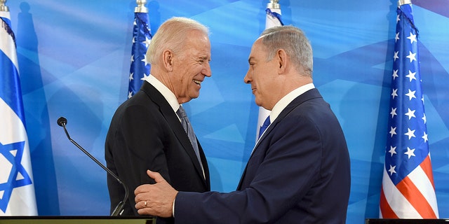 FILE PHOTO: Then-U.S. Vice President Joe Biden shakes hands with Israeli Prime Minister Benjamin Netanyahu as they deliver joint statements during their meeting in Jerusalem March 9, 2016. 