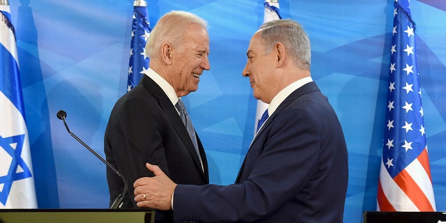 FILE PHOTO: Then-U.S. Vice President Joe Biden shakes hands with Israeli Prime Minister Benjamin Netanyahu as they deliver joint statements during their meeting in Jerusalem March 9, 2016. 