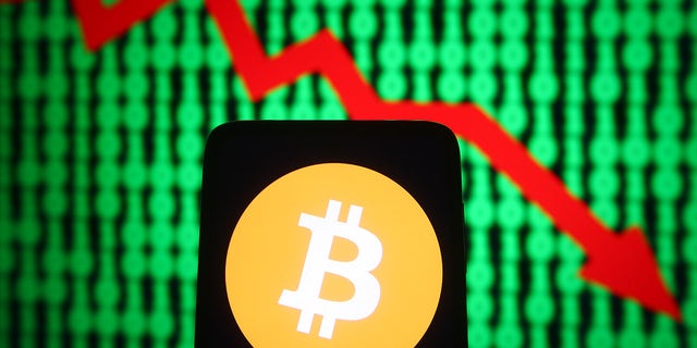 Bitcoin (BTC) cryptocurrency is seen going down. (Photo Illustration by Pavlo Gonchar/SOPA Images/LightRocket via Getty Images)
