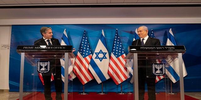 Secretary of State Antony Blinken, left, speaks as Israeli Prime Minister Benjamin Netanyahu listens during a joint statement after a meeting at the Prime Minister's office, Tuesday, May 25, 2021, in Jerusalem, Israel. (AP Photo/Alex Brandon, Pool)