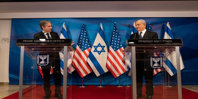 Secretary of State Antony Blinken, left, speaks as Israeli Prime Minister Benjamin Netanyahu listens during a joint statement after a meeting at the Prime Minister's office, Tuesday, May 25, 2021, in Jerusalem, Israel. (AP Photo/Alex Brandon, Pool)