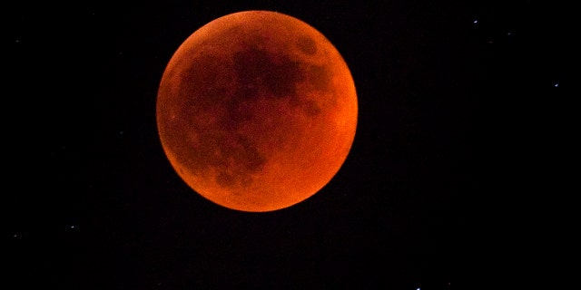 A total lunar eclipse is seen on June 15, 2011 in Jerusalem, Israel. The longest lunar eclipse for a decade took place tonight. A lunar eclipse comes when the sun, Earth and moon line up and Earth's shadow falls on the moon. (Photo by Uriel Sinai/Getty Images)