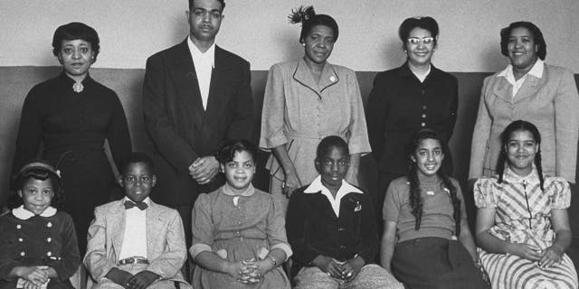 Portrait of the African-American students for whom the famous Brown vs Board of Education case was brought and their parents: (front row L-R) Vicki Henderson, Donald Henderson, Linda Brown, James Emanuel, Nancy Todd, and Katherine Carper; (back row L-R) Zelma Henderson, Oliver Brown, Sadie Emanuel, Lucinda Todd, & Lena Carper, Topeka, Kansas, 1953. (Photo by Carl Iwasaki/The LIFE Images Collection via Getty Images/Getty Images)