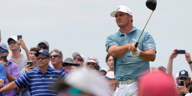 Bryson DeChambeau watches his tee shot on the 14th hole during a practice round at the PGA Championship golf tournament on the Ocean Course Wednesday, May 19, 2021, in Kiawah Island, S.C. (AP Photo/David J. Phillip)