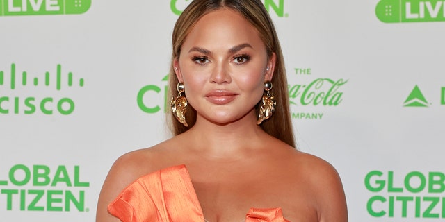 Farrah Abraham is still tapping her watch awaiting a personal apology from Chrissy Teigen\, pictured here. (Photo by Emma McIntyre/Getty Images for Global Citizen VAX LIVE)