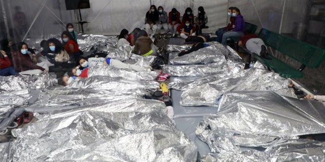 This image shows packed migrants in Donna, Texas in March.