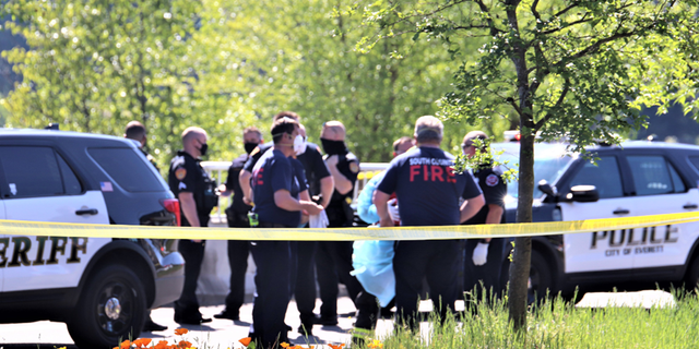 Police arriving on the scene of a shooting.