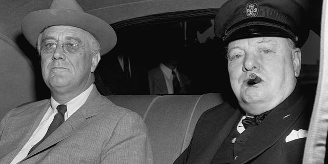 Prime Minister Churchill arrives at the White House with President Roosevelt. It is presumed that the two will discuss military plans for the European theater.