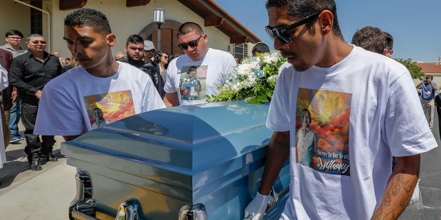 Victor Avalos, right, father of Anthony Avalos, and other family members bring out the casket after funeral services held at Saint Junipero Serra Parish on July 20, 2018 in Quartz Hills, California. (Getty Images)