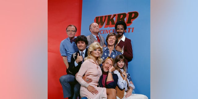Pictured left to right: Richard Sanders (as news director Les Nessman), Frank Bonner (as advertising salesman Herb Tarlek), Loni Anderson (as receptionist Jennifer Marlowe), Gordon Jump (as general manager Arthur 'Big Guy' Carlson), Howard Hesseman (as morning disk jockey Dr. Johnny Fever), Gary Sandy (as radio program director Andy Travis), Jan Smithers (as assistant and traffic coordinator Bailey Quarters) and Tim Reid (as nighttime disc jockey Venus Flytrap) star on WKRP in Cincinnati, a CBS television situation comedy about characters at a radio station. Originally broadcast September 18, 1978.