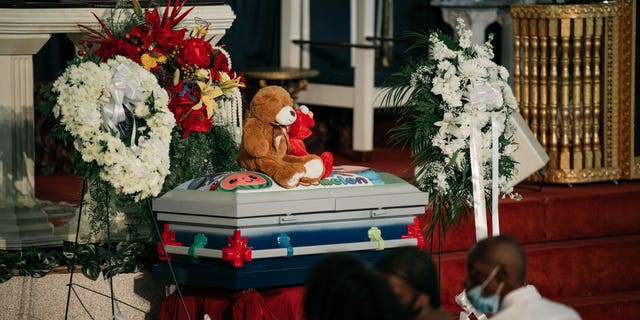 The casket of Davell Gardner Jr. sits near the altar of Pleasant Grove Baptist Church on July 27, 2020 in New York City. Family, local elected officials, and clergy gathered at Davell's funeral to mourn his loss and condemn the gun violence responsible for his death at a Brooklyn cookout on July 12. (Photo by Scott Heins/Getty Images)