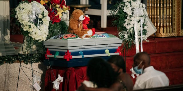 The casket of Davell Gardner Jr. sits near the altar of Pleasant Grove Baptist Church on July 27, 2020 in New York City. Family, local elected officials, and clergy gathered at Davell's funeral to mourn his loss and condemn the gun violence responsible for his death at a Brooklyn cookout on July 12. (Photo by Scott Heins/Getty Images)