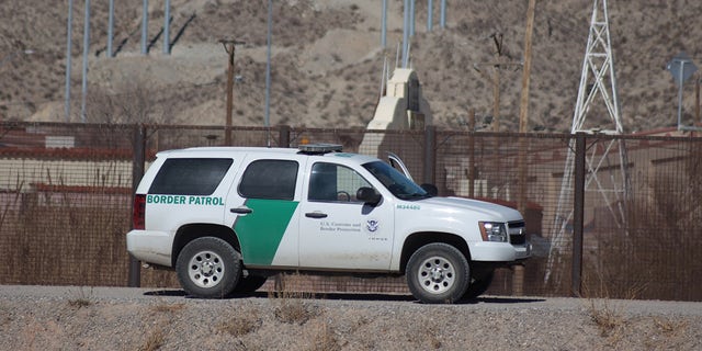 Border Patrol agents detain migrants after crossing the Rio Grande natural border between El Paso, state of Texas, US, and Ciudad Juarez, Chihuahua state, Mexico on Jan. 22, 2021. 