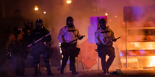 MINNEAPOLIS, MN - MAY 30: Riot police advances toward protesters at the intersection of E 31st St and S 3rd Ave on Saturday, May 30, 2020, in Minneapolis, MN. Protests in the wake of the death of George Floyd while in police custody has erupted across the country. (Photo by Salwan Georges/The Washington Post via Getty Images)