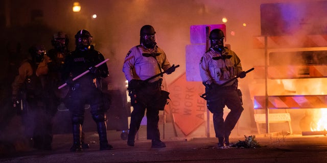 MINNEAPOLIS, MN - MAY 30: Riot police advances toward protesters at the intersection of E 31st St and S 3rd Ave on Saturday, May 30, 2020, in Minneapolis, MN. Protests in the wake of the death of George Floyd while in police custody has erupted across the country. (Photo by Salwan Georges/The Washington Post via Getty Images)