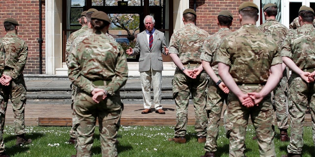 Prince Charles, Prince of Wales addresses soldiers of the Welsh Guards during a visit to Combermere Barracks on May 5, 2021, in Windsor, England. 