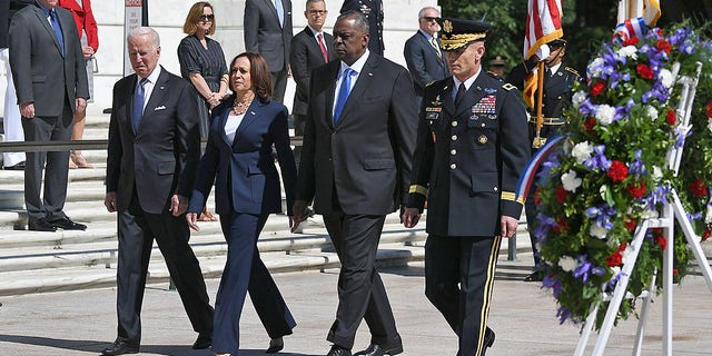 President Biden, Vice President Kamala Harris, Defense Secretary Lloyd Austin and Chairman of Joint Chiefs of Staff General Mark Milley arrive to take part in a wreath-laying in front of the Tomb of the Unknown Soldier at Arlington National Cemetery on Memorial Day in Arlington, Va., on May 31, 2021. 