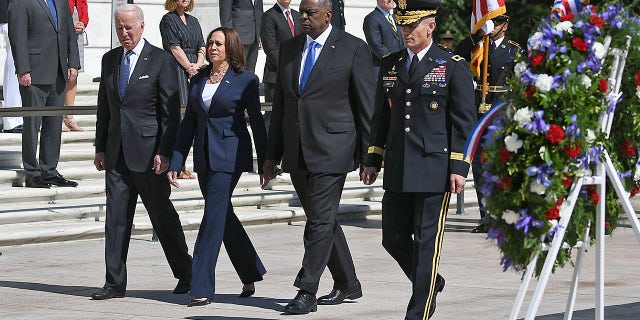 President Biden, Vice President Kamala Harris, Defense Secretary Lloyd Austin and Chairman of Joint Chiefs of Staff General Mark Milley arrive to take part in a wreath-laying in front of the Tomb of the Unknown Soldier at Arlington National Cemetery on Memorial Day in Arlington, Va., on May 31, 2021. 