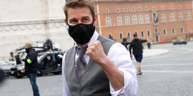 Actor Tom Cruise talks and takes a selfie with his fans during a break from the set of Mission Impossible 7 in Piazza Venezia, right in front of the Victor Emmanuel II Monument (Tomb of the Unknown Soldier).