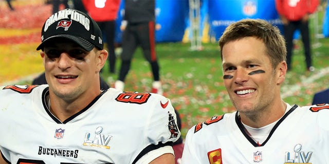 Rob Gronkowski #87 and Tom Brady #12 of the Tampa Bay Buccaneers celebrate after defeating the Kansas City Chiefs in Super Bowl LV at Raymond James Stadium on February 07, 2021, in Tampa, Florida. The Buccaneers defeated the Chiefs 31-9.