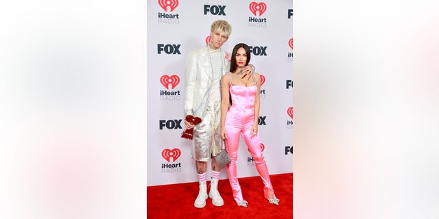 Machine Gun Kelly, winner of the Alternative Rock Album of the Year award for 'Tickets To My Downfall,’ and Megan Fox make it a date night. (Photo by Emma McIntyre/Getty Images for iHeartMedia)