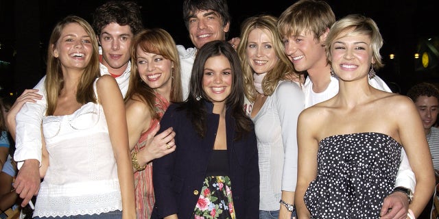 Cast of 'The OC' from left: Mischa Barton, Adam Brody, Melinda Clarke, Peter Gallagher, Kelly Rowan, Benjamin McKenzie, Samaire Armstrong and Rachel Bilson (center).