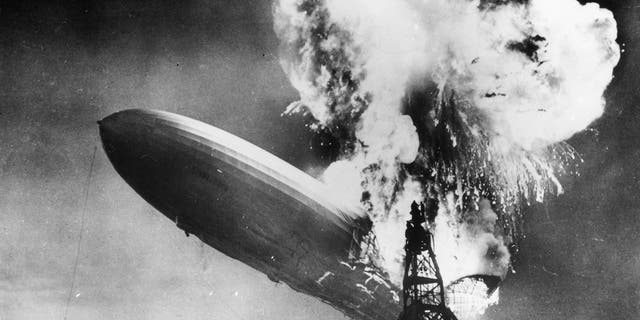 The Hindenburg (LZ-129) disaster at Lakehurst, New Jersey, which marked the end of the era of passenger-carrying airships. The image of the crash of the Nazi-era German aircraft played prominently in the branding of Led Zeppelin, appearing on the cover of its first two albums.
