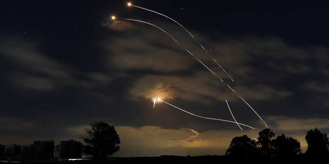 Israeli Iron Dome air defense system launches to intercept rockets fired from Gaza Strip, near Sderot, Israel, Thursday, May 13, 2021. (AP Photo/Ariel Schalit)