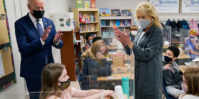 President Joe Biden and First Lady Jill Biden applaud a student as she demonstrates her project during a visit to Yorktown Elementary School, Monday, May 3, 2021, in Yorktown, Va. (AP Photo/Evan Vucci)