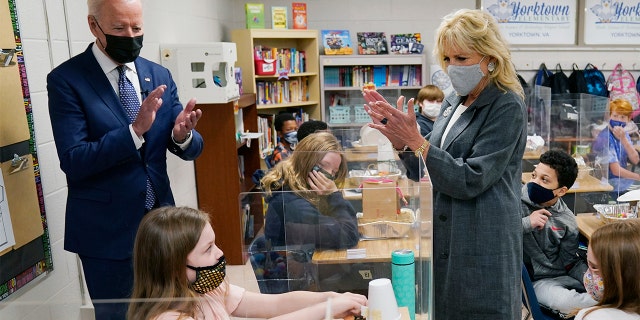 President Joe Biden and First Lady Jill Biden applaud a student as she demonstrates her project during a visit to Yorktown Elementary School, Monday, May 3, 2021, in Yorktown, Va. (AP Photo/Evan Vucci)