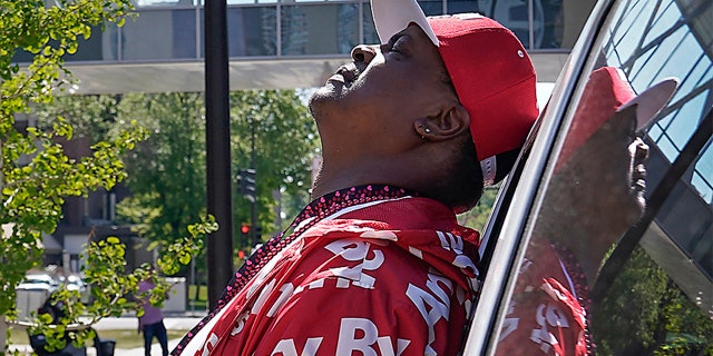 Anti-violence activist K.G. Wilson tips his head back in anguish while waiting to hear the status of his 6-year-old granddaughter who was shot in the head late Monday, Minneapolis, Tuesday, May 18, 2021. She later died. (David Joles/Star Tribune via AP)