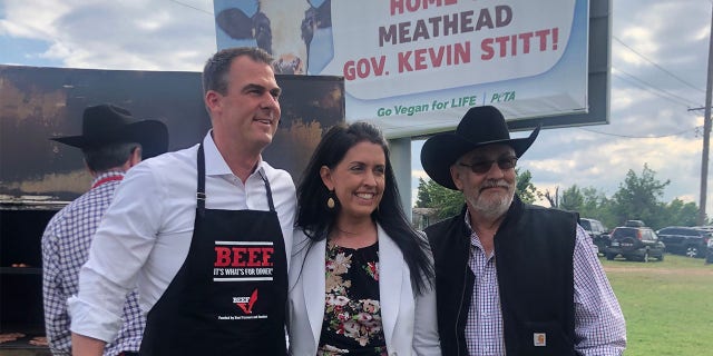 Oklahoma Governor Kevin Stitt (R) with state Secretary of Agriculture Blayne Arthur and Representative David Hardin (R) at a meat cookout on May 12, 2021, in Oklahoma City.
