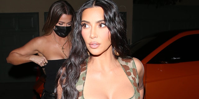 Kim Kardashian removed a portion of her mobile game that seemingly referenced Meghan Markle and Prince Harry.
