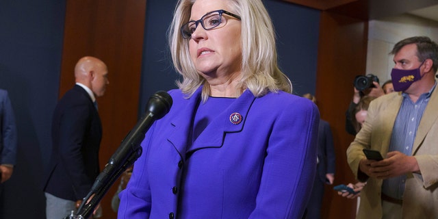 Rep. Liz Cheney speaks to reporters after House Republicans voted to oust her as chair of the GOP conference, at the Capitol, May 12, 2021.
