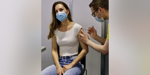 In this photo released by Kensington Palace on Saturday, May 29, 2021, Britain's Kate, the Duchess of Cambridge receives her coronavirus vaccine at London's Science Museum on Friday. 