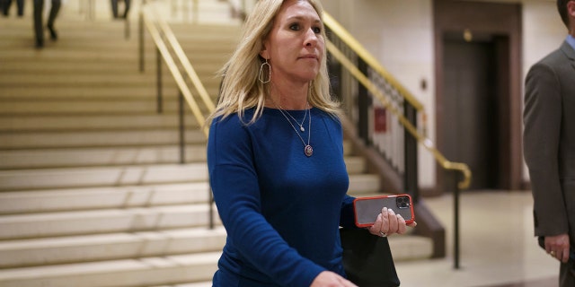 FILE - Rep. Marjorie Taylor Greene, R-Ga., arrives for a meeting at the Capitol in Washington, Thursday, May 13, 2021.