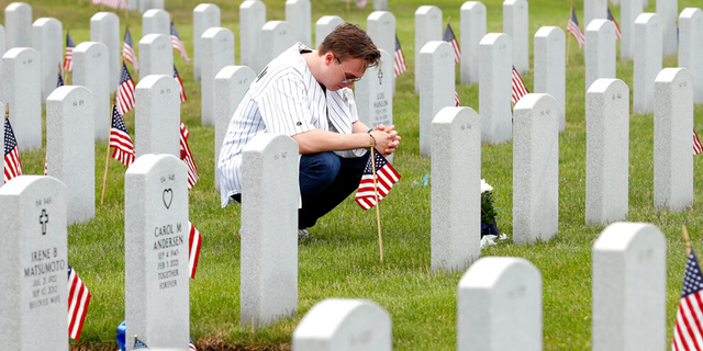 On Memorial Day, a young American pauses to honor the deceased.