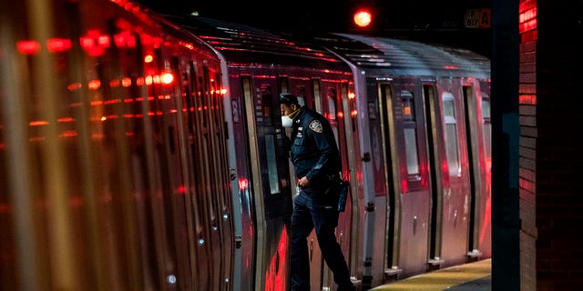 A Metropolitan Transportation Authority (MTA) officer looks for passengers at the last stop at the Coney Island station in Brooklyn, New York.