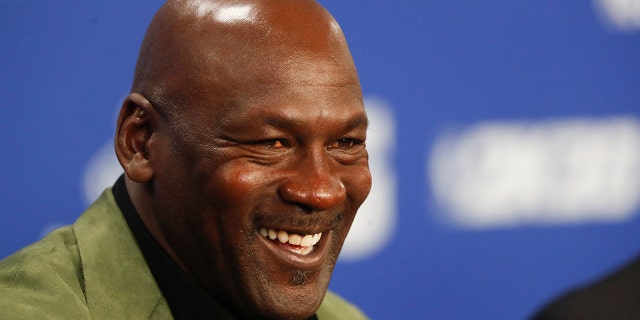 In this Jan.  On February 24, 2020 file photo, former basketball superstar Michael Jordan speaks at a press conference ahead of a game between the Charlotte Hornets and the Milwaukee Bucks in Paris.