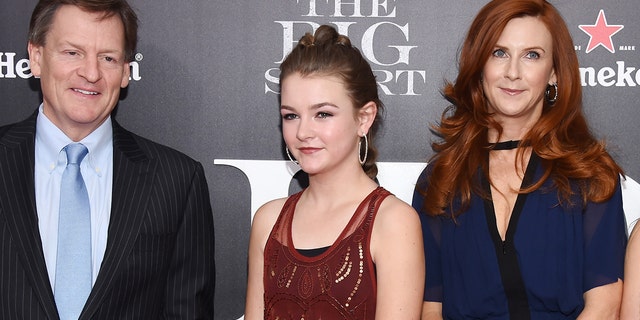 Dixie Lewis, center, the daughter of Michael Lewis, left, and Tabitha Soren, right, died this week in a head-on vehicle collision on a highway in Truckee, Calif. Dixie was killed alongside her boyfriend, Ross. The two were both athletes and had recently graduated from Berkeley High School. (Photo by Dimitrios Kambouris/Getty Images)