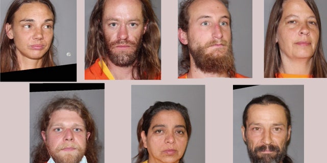 The seven people who have been charged in connection with the discovery of a mummified body. 