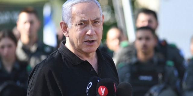 Israeli Prime Minister Benjamin Netanyahu meets with Israeli border police on Thursday, May 13, 2021 in Lod, near Tel Aviv after a wave of violence in the city the night before. (AP Photo/Yuval Chen, Yediot Ahronot, Pool)