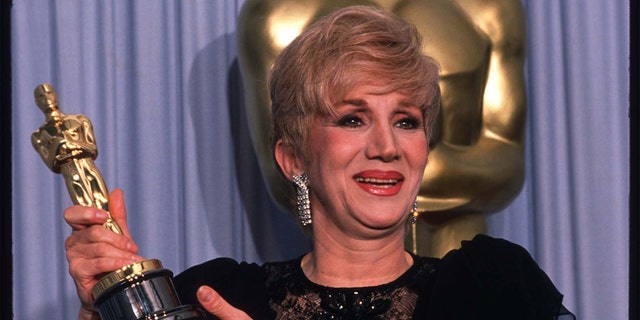 Actress Olympia Dukakis holds her Best Actress in a Supporting Role Oscar for 'Moonstruck' at the Academy Awards April 11, 1988, in Los Angeles, CA. 